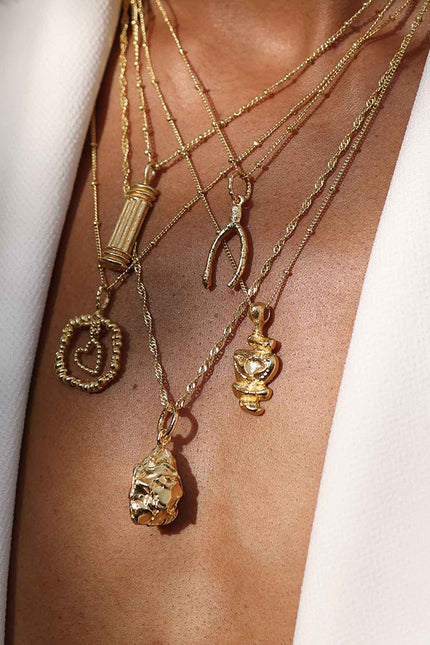 Close Model shot of model Stacking Different demi fine Jewellery Necklaces By arvino