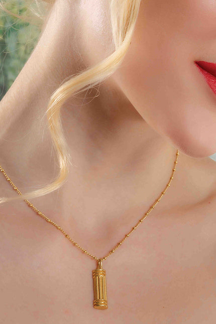 Model Shot Wearing Sculpted Pillar Necklace. Gold Plated Necklace By Arvino.