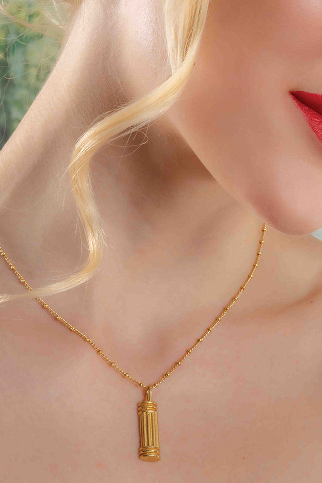 Model Shot Wearing Sculpted Pillar Necklace. Gold Plated Necklace By Arvino.