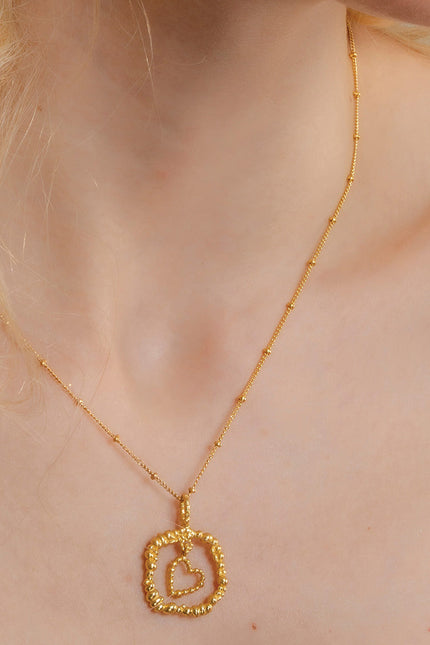 Model Wearing Gold plated Granulated Heart Necklace In 925 Sterling Silver By Arvino