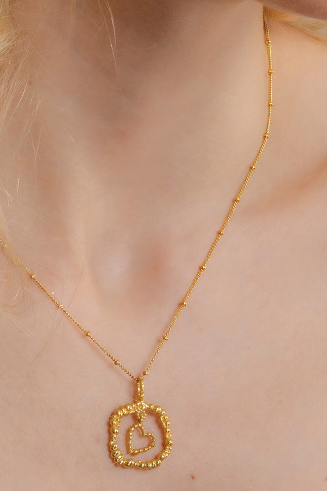 Model Wearing Gold plated Granulated Heart Necklace In 925 Sterling Silver By Arvino
