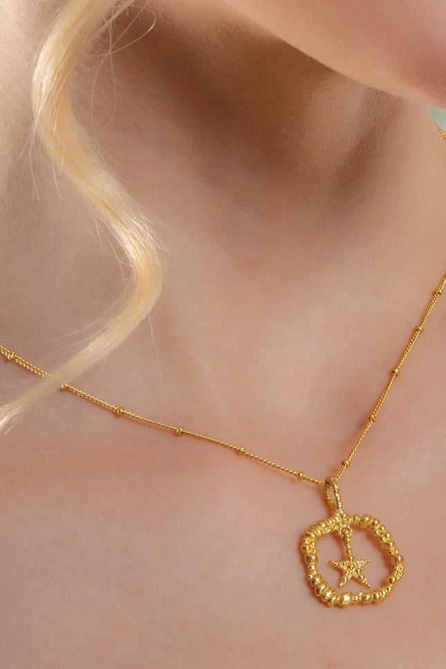 Model Wearing Silver Granulated Star Necklace by Arvino on neck