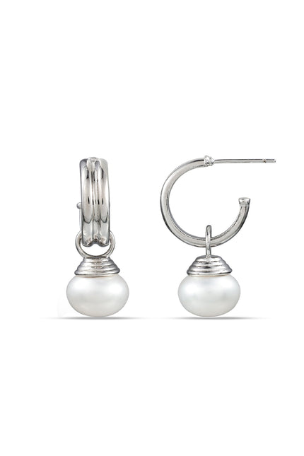 A pair of sterling silver hoop earrings with pearls attached to them, displayed against a white background.