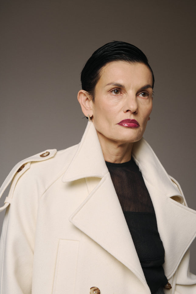 This Wool Short Coat defines effortless elegance with a modern, sculptural edge.