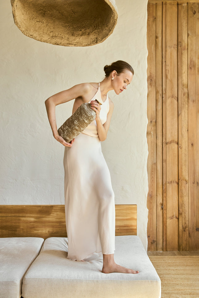 This Viscose Maxi Dress with an open back effortlessly combines elegance and versatility. Crafted from soft, breathable viscose, the dress offers a comfortable fit while maintaining a chic, flattering silhouette. The open back design adds a touch of sensuality, making it perfect for both casual and special occasions