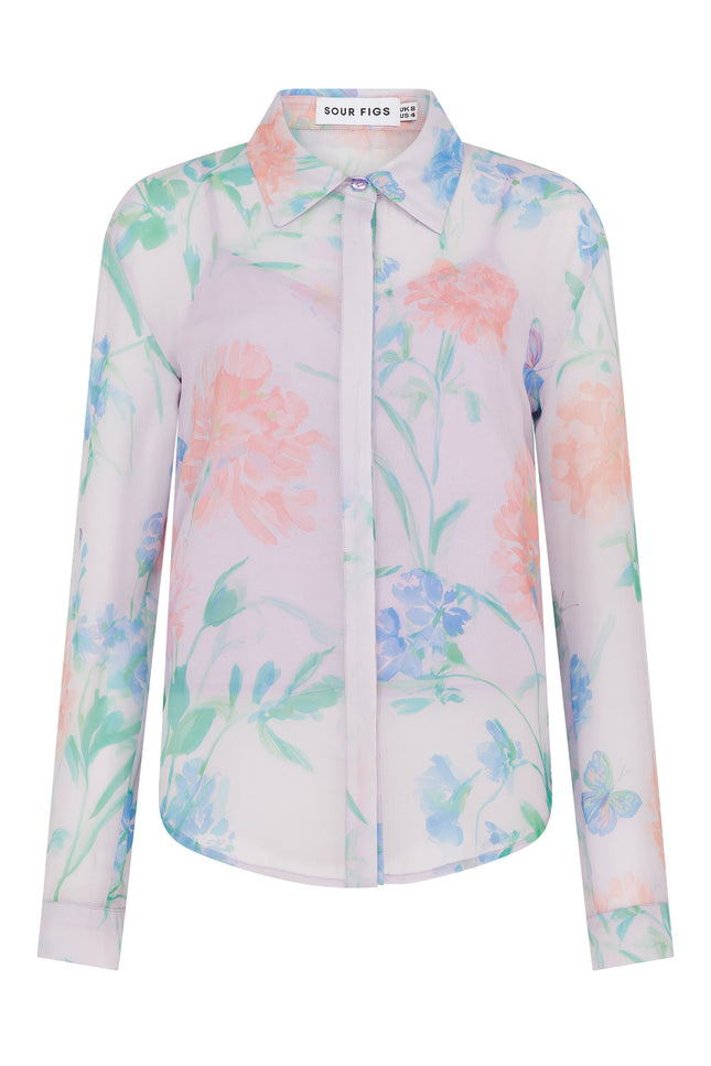 SOUR FIGS romantic printed blouse with slip top, curved hemline, buttoned cuffs and pastel wildflower artwork.