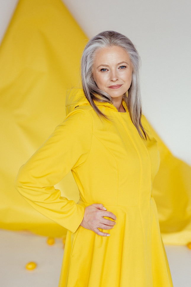 Side view of Yellow Sun coat – cinched waist and hidden side pockets.