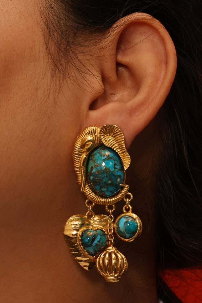 Close up shot of Arvino Turquoise Dream Danglers Earrings made up in 925 sterling and gold plated