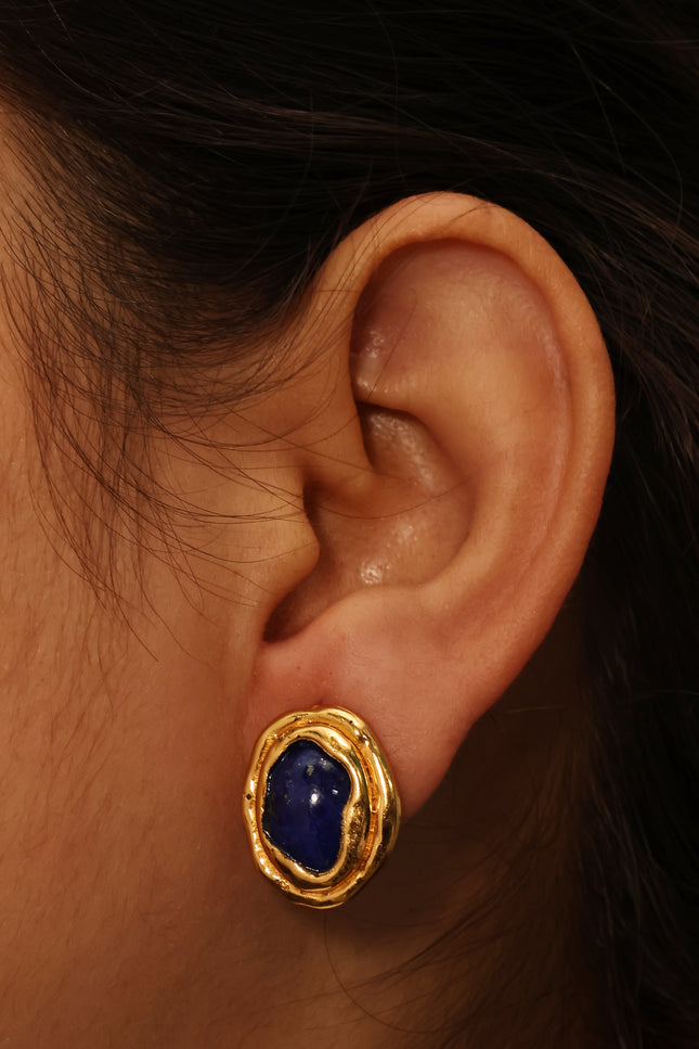 Close up model shot of Arvino Demi Fine Midnight lapis lazuli ocean stud earrings