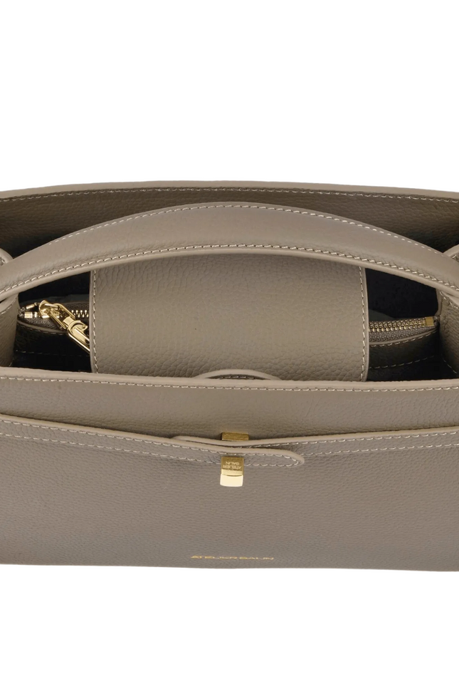 Open beige atelier galin cube lock handbag with gold logo hardware on a white background