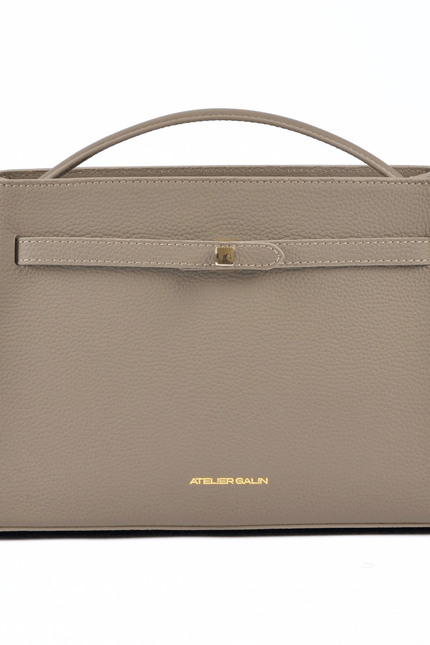 Beige atelier galin cube lock bag with 'Atelier Galin' branding on a white background