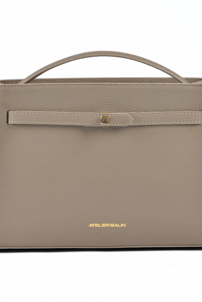 Beige atelier galin cube lock bag with 'Atelier Galin' branding on a white background