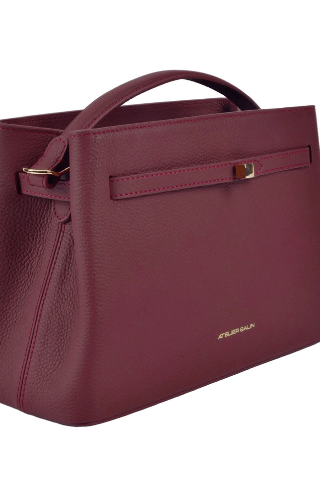 red leather atelier galin handbag with gold cube clasp