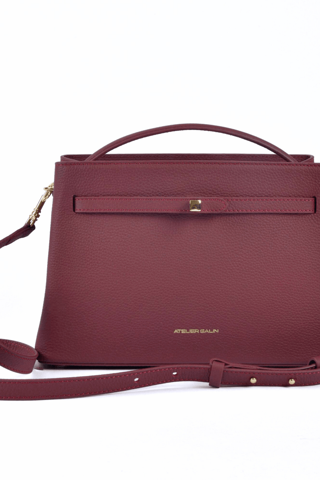 burgundy red leather atelier galin handbag with gold cube lock 