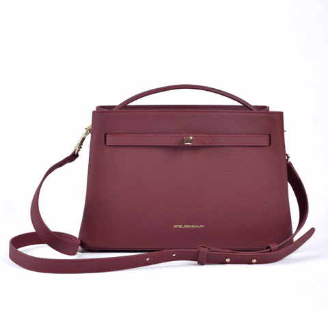 burgundy red leather atelier galin handbag with gold cube lock 