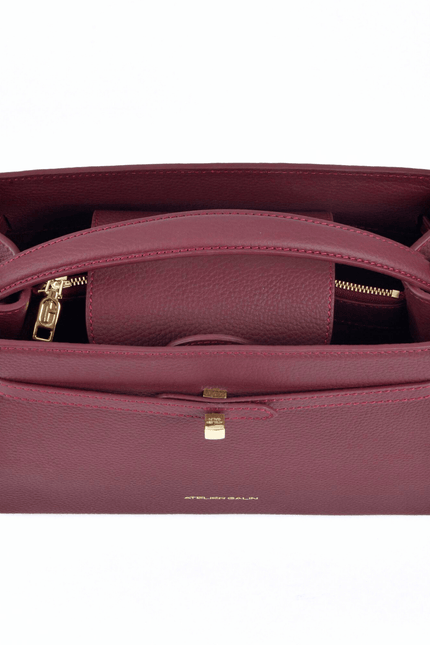 red leather atelier galin handbag with gold cube clasp details