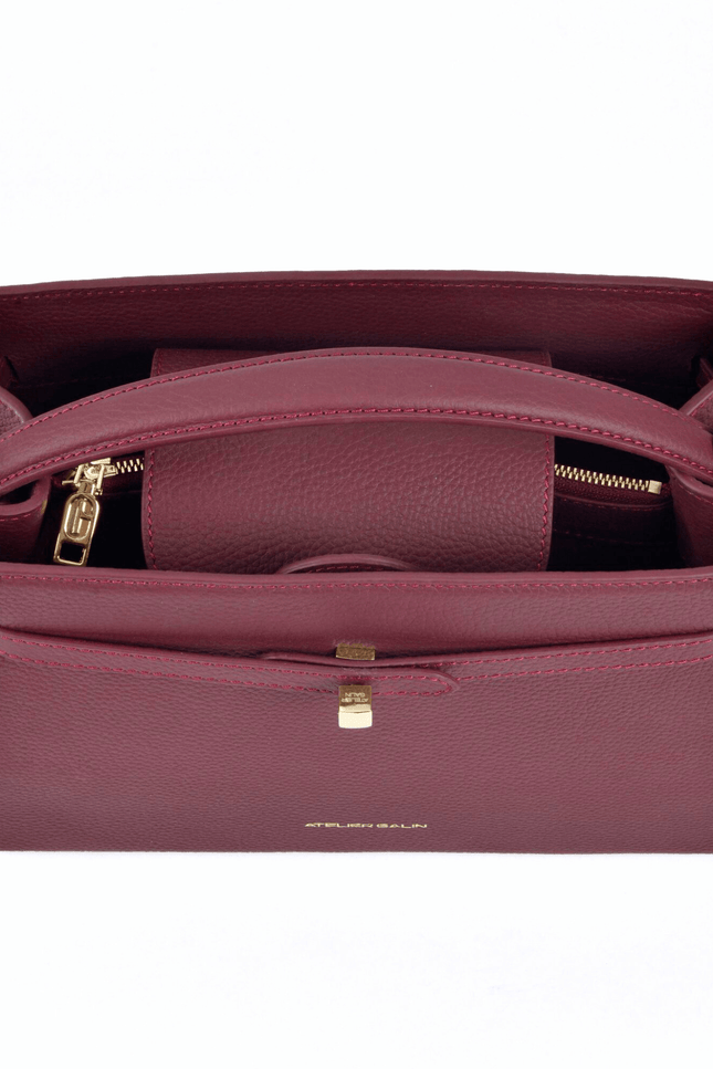 red leather atelier galin handbag with gold cube clasp details