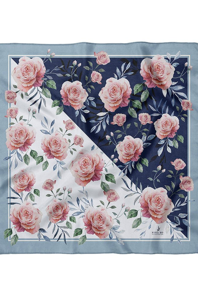 100% pure silk square scarf featuring a modern diagonal color-block design of pure white and midnight blue with watercolor pink roses and blue leaves, flat lay view.