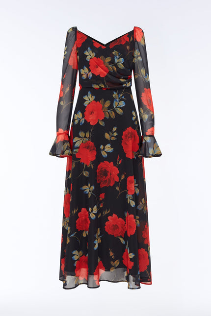 Portrait front product view of the SOUR FIGS Floral Long-Sleeve Maxi Dress in Midnight Rose Black, with red roses, a ruched V-neck bodice and sheer sleeves with flared cuffs.