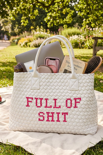 White vegan woven handbag by Lilly Loves with pink accents, featuring a textured handwoven design and stylish full of shit graphic.