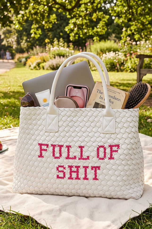 White vegan woven handbag by Lilly Loves with pink accents, featuring a textured handwoven design and stylish full of shit graphic.