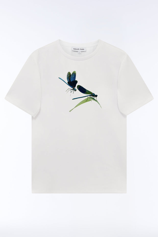 Front view of the SOUR FIGS Metallic Damselfly Print Unisex T-Shirt in White, featuring two blue and green damselflies, a green leaf and a crew neckline.
