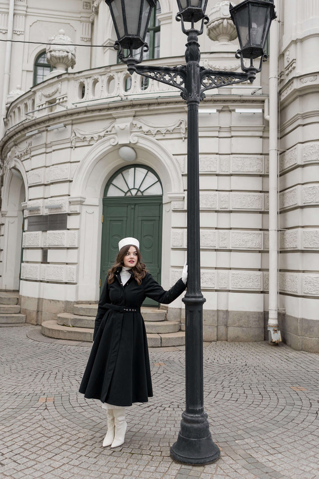 Luxury winter outerwear for women — Obsidian Frost coat with hidden side pockets and fitted bodice.