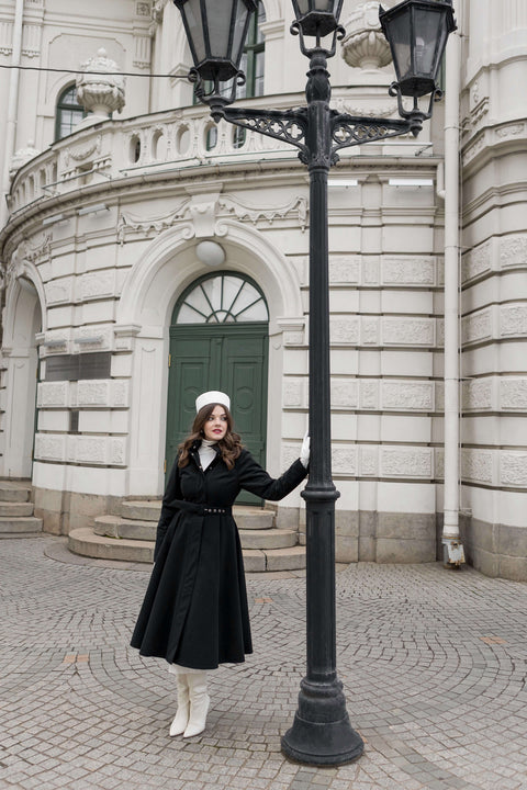 Luxury winter outerwear for women — Obsidian Frost coat with hidden side pockets and fitted bodice.