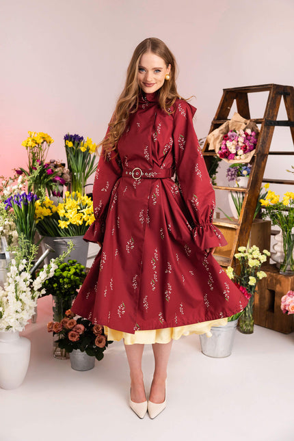 Red floral coat with flared skirt and gathered sleeves
