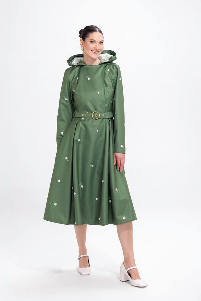 Primrose in Bloom green waterproof women's double-breasted trench coat with white floral print, front view
