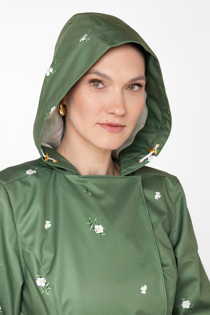 Close-up of hood detail on Primrose in Bloom green waterproof floral women's coat
