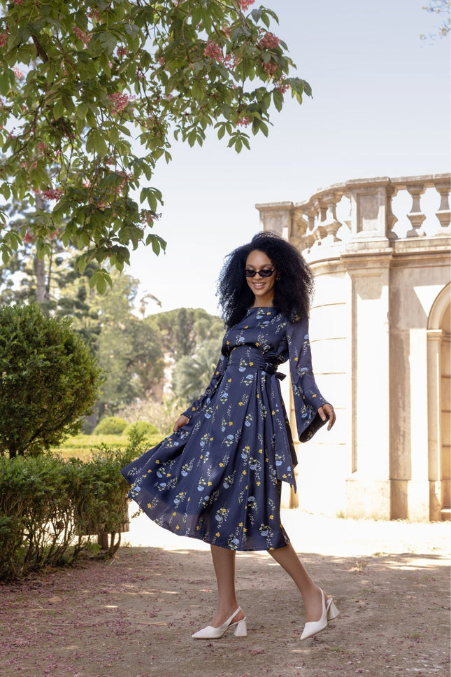Meadow Dream midi dress with adjustable drawstring waist and long flared sleeves in a romantic feminine silhouette