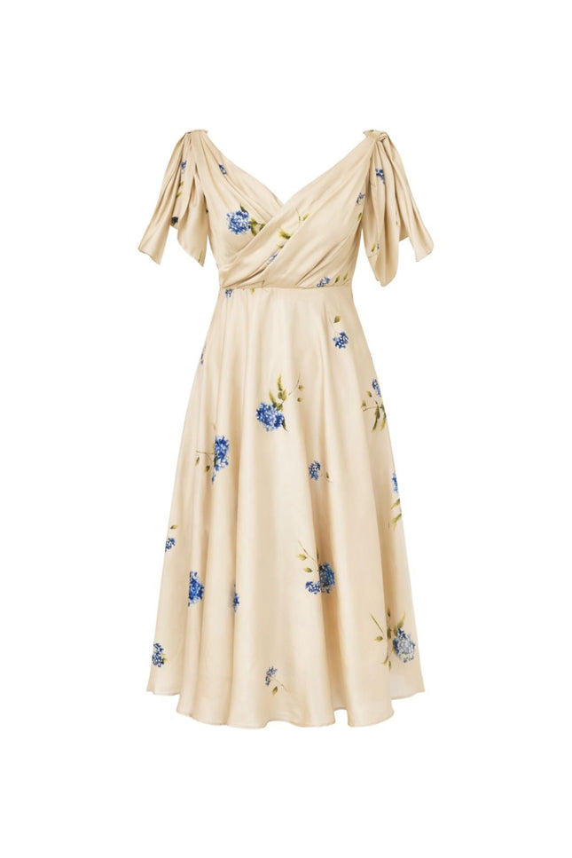 A cream-colored midi dress with a blue and green floral print, featuring short pleated sleeves and a V-neckline, shown against a plain white background.