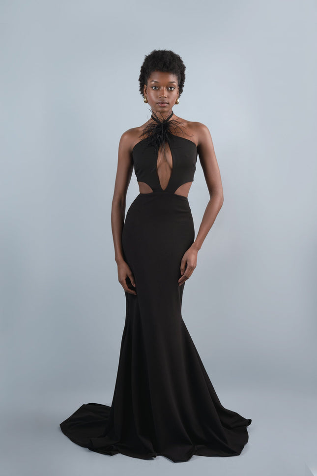 A woman wearing the Roseline long mermaid dressin black by Anitabel, posed against a light grey background.