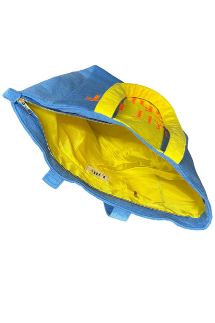 Lilly Loves Terry Handbag with blue and yellow Ciao towel design, featuring a casual, colorful tote style with handles.
