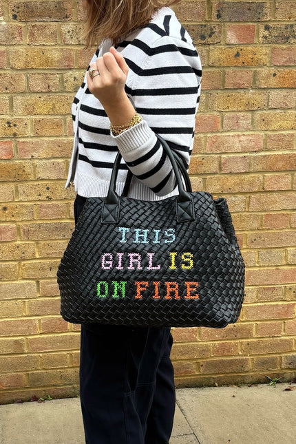 Lilly Loves "This Girl Is On Fire" handbag featuring a bold, fiery design and stylish shape, perfect for fashion-forward outfits.