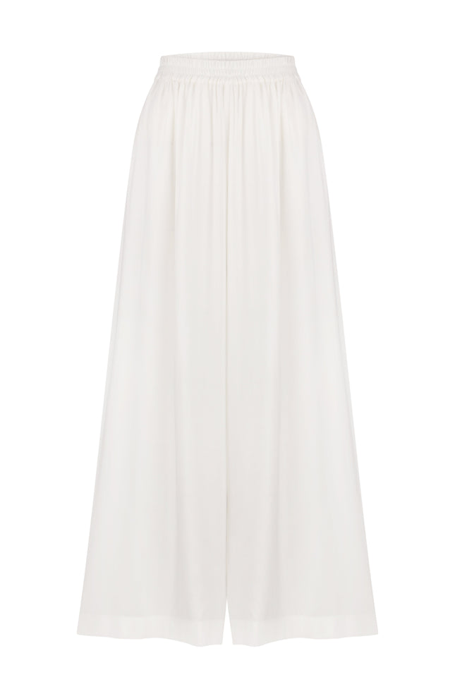 A pair of white wide-leg trousers made of cotton, with an elastic band at the waist for comfort.
