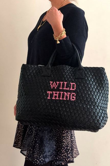 Wild Thing vegan woven handbag by Lilly Loves featuring colorful woven design and sturdy handles on a plain background.