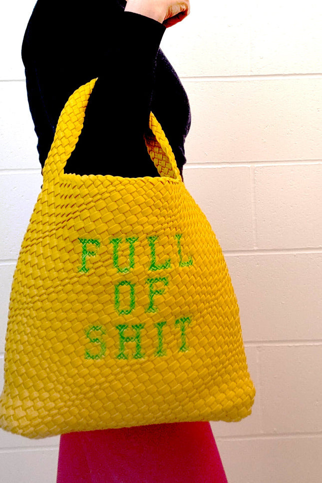 Yellow woven bucket handbag by Lilly Loves with a rounded shape and shoulder strap, featuring a vibrant, textured design.
